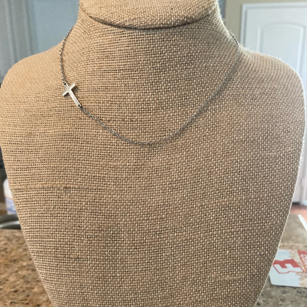 Silver side cross necklace.